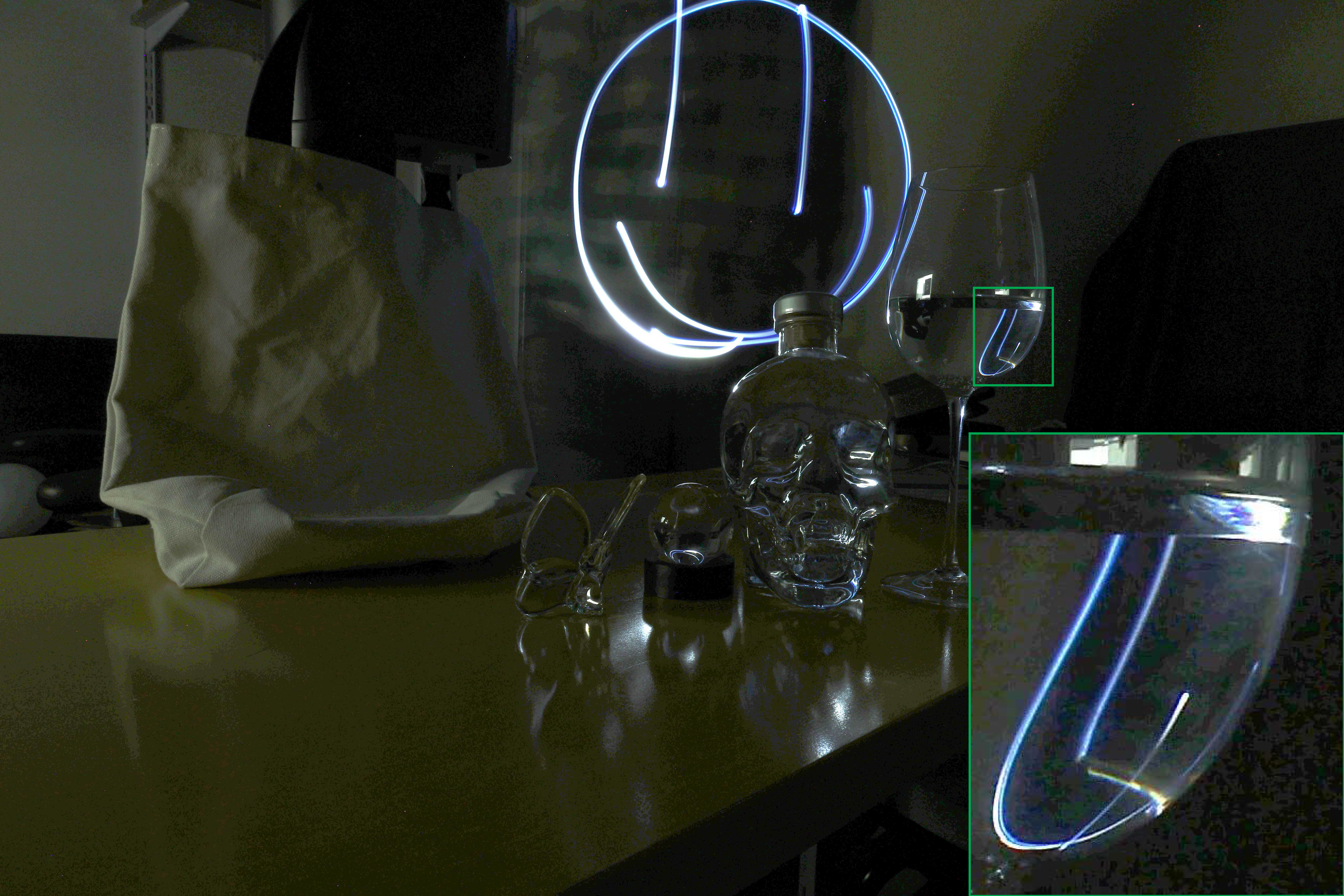 Traditional light painting showing wine glass refraction with inset close-up